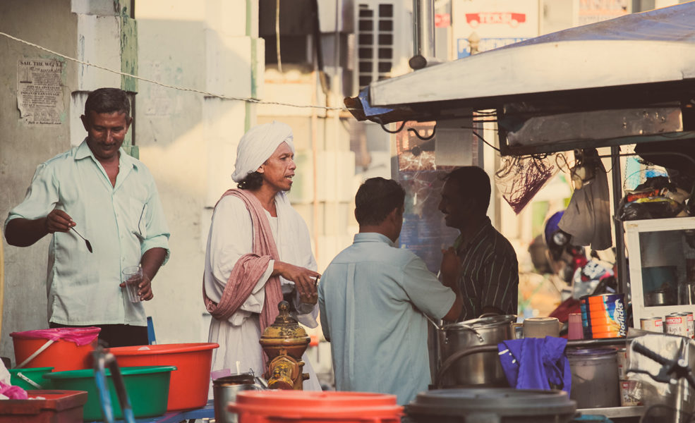 Men gathered around food store